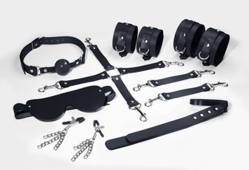 Набір Feral Feelings BDSM Kit 7 Black, наручники, поножі, конектор, маска, падл, кляп, затискачі SO8276 SafeYourLove